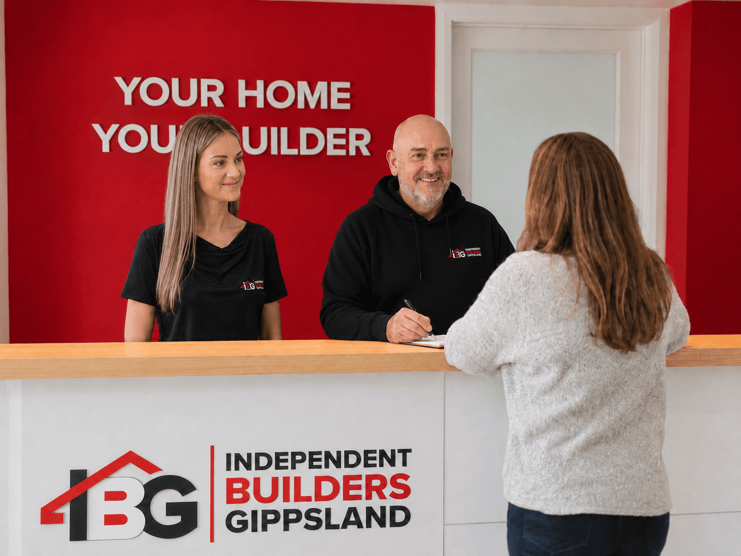 Independent Builders Gippsland team welcoming a client at reception