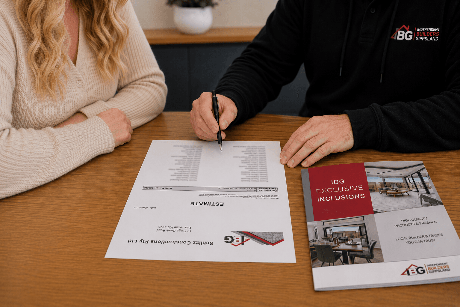 Builder and client reviewing estimate and plan documents together