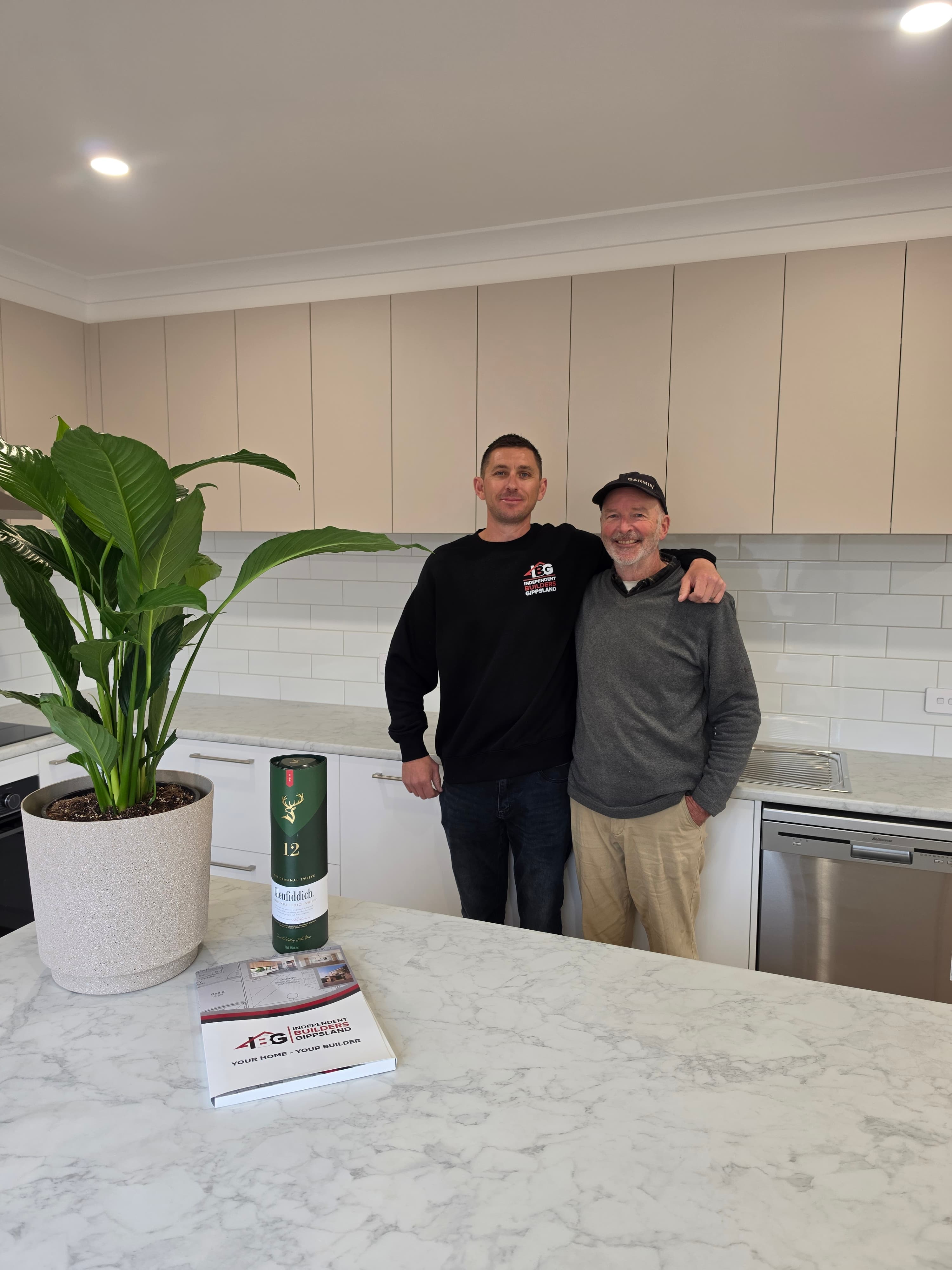 Independent Builders Gippsland discussing a completed build with clients